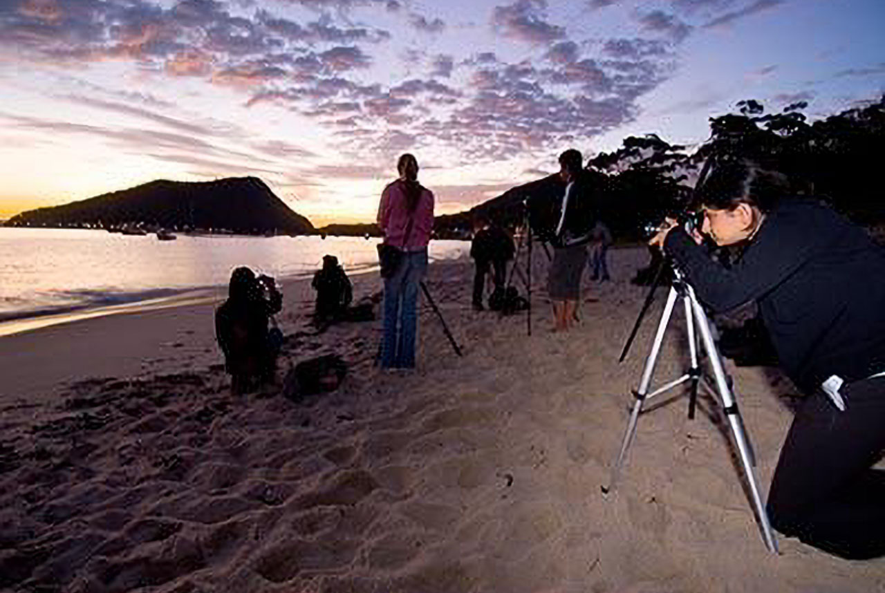 Professional photography students dawn shoot at beach